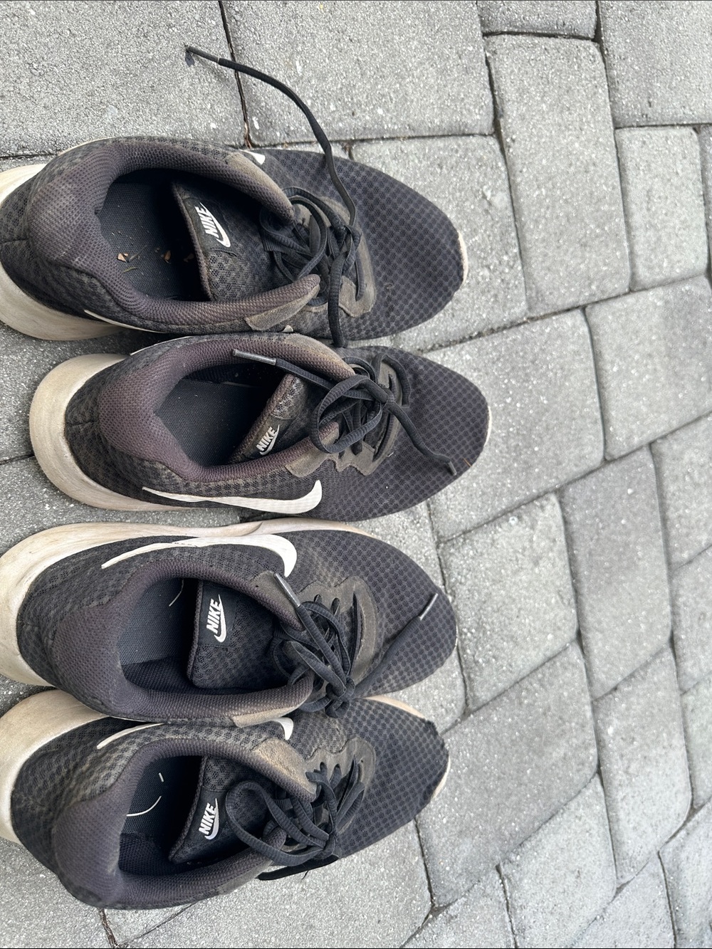Two pairs of Nike Black & White Athletic Sneakers